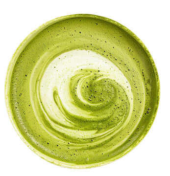 Aerial view of vibrant green matcha latte in round bowl, showcasing beautiful swirl pattern. rich color and creamy texture evoke sense of calm and relaxation