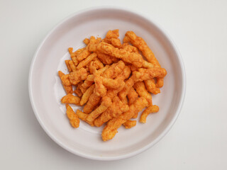 Crispy corn snacks on white plate