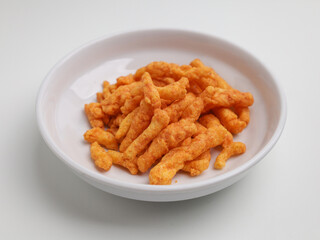 Crispy corn snacks on white plate