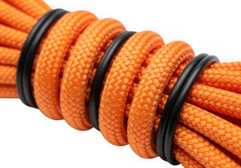 Close up of an orange nylon rope secured with black elastic bands creating a spiral pattern isolated on transparent background