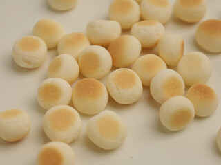 Mini biscuit balls on white background