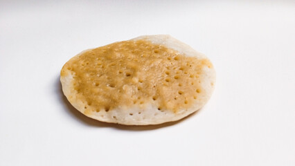 Tasty rice flour pancake or serabi with brown sugar flavor. Indonesian traditional pancake on white background. Close up