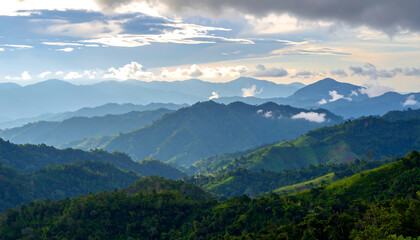 Breathtaking mountain landscape showcasing lush greenery, rolling hills, and dramatic cloud formations under serene sky