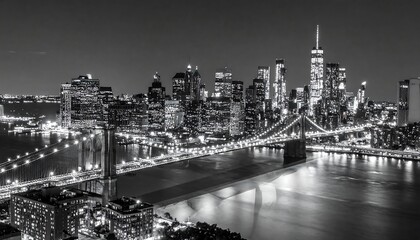 Obraz premium Night view of a city skyline and bridge, in black and white