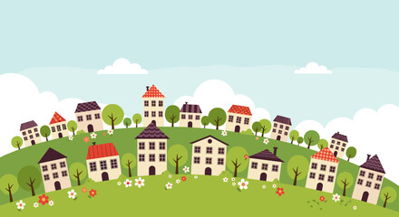 Fototapeta premium Charming collection of whimsical homes nestled on a rolling green landscape under a bright blue sky