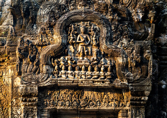 Intricate Stone Carvings on Ancient Temple Facade, in Angkor Wat, Cambodia