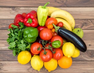 Assortment of fresh fruits and vegetables on a wooden background