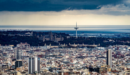 Dramatic Coastal Cityscape Under Cloudy Sky in Barcelona, Spain