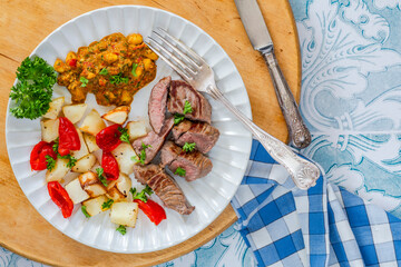 Lamb with smoky pepper sauce and saute potatoes