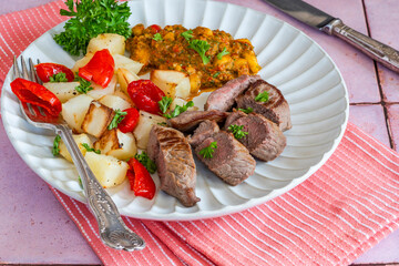 Lamb with smoky pepper sauce and saute potatoes