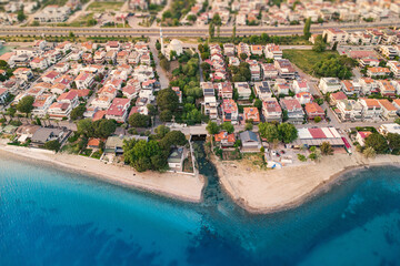 Capturing an aerial view of a vibrant residential district meeting the sparkling Mediterranean Sea...