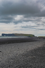 Black Sand Beach with Dyrholaey Promontory and Natural Arch in Iceland