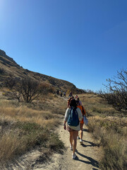 Naklejka premium A group of travelers climbing the mountains