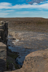 Powerful Waterfall Cascading Over Rocky Cliff in Iceland