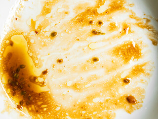 Dirty plate top view background, finished eat dinner in restautant, abstract textuer stain smearing drip sauce bbq jam chilli jelly on ceramic breakfast, concept for clean hyginene product.