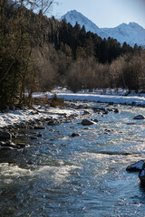 mountain river in winter with snow