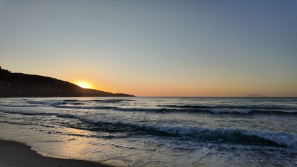 a a movement of stars in the night sky with the view of mountains.