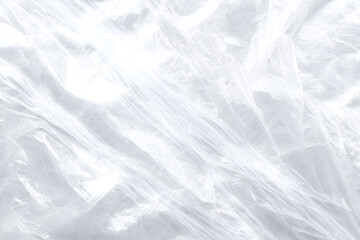 Obraz premium Abstract Plastic Texture: A high-angle, photorealistic view of transparent plastic, captured with intricate detail, revealing a subtly textured surface that evokes a sense of ephemeral lightness.