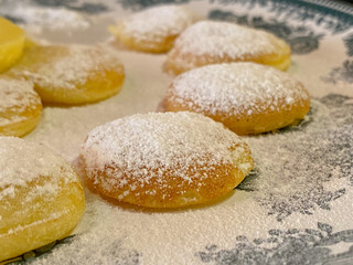 Dutch Mini Pancakes Poffertjes sprinkled with powdered sugar