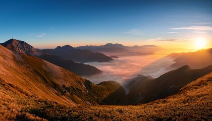 misty mountain range at dawn wide angle captures a stunning and breathtaking scene