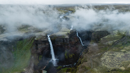 Haifoss waterfalls cascading through the breathtaking landscapes of Icelandic highlands