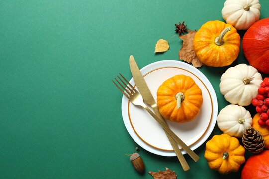 Rustic holiday table setup. Top view with plates, cutlery and autumn decorations. Empty space for your text. Thanksgiving Day or Harvest festival - Powered by Adobe