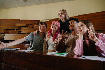 Group of Diverse Students Enjoying Time Together in a College Classroom Setting