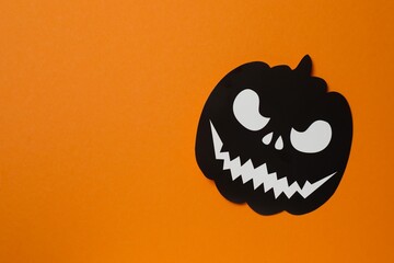 Halloween festive background with black pumpkin. Top view