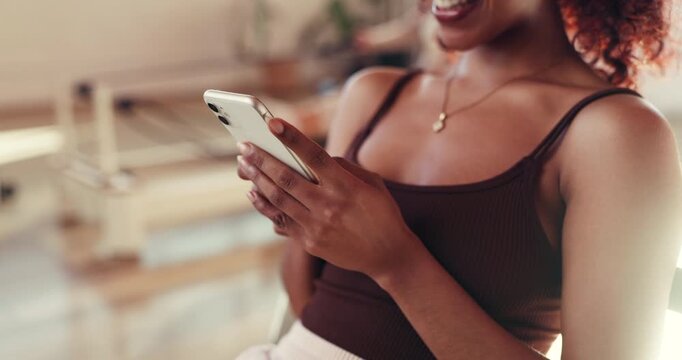 Hands, phone and yoga with woman in studio to check app for online fitness progress or schedule. Social media, text message and typing with yogi person in health class for communication or exercise