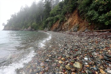 Foggy coastal beach with multicolored stones