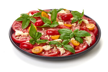 Tomato Salad Caprese with Basil, isolated on white background.