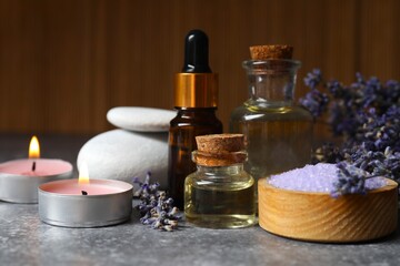 Spa composition with herbal oil and lavender flowers on the table. Beauty treatments. Lavender essential oil still life