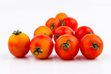 Red ripe tomatoes on white background