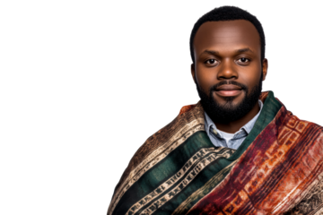 Man in traditional wrap standing confidently with a serious expression