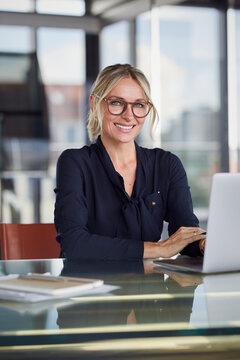 Authentic professional showing leadership and optimism at the office