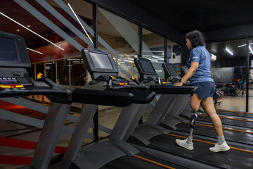 People with disability doing walking workout exercise using treadmill at gym for healthy and recovery concept
