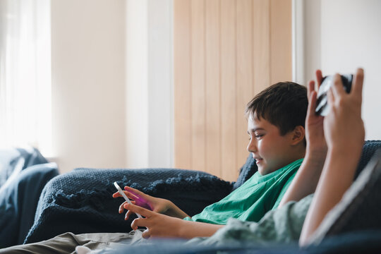 Education Concept.Happy elementary classmates doing homework on digital tablet,During lesson two school pupils using digital tablet and smart mobile phone after school,Home schooling with technology - Powered by Adobe