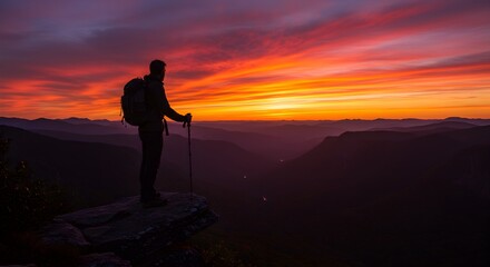 silhouette of a woman standing on a rock