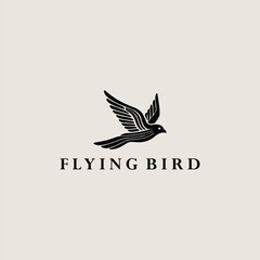 Fototapeta premium Flying bird logo vector icon illustration