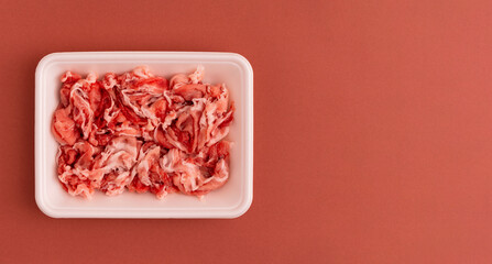 pork scraps in a food tray of polystyrene foam....