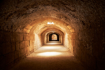 Obraz premium Connecting corridor in the basement of the El Jem amphitheater with poor lighting