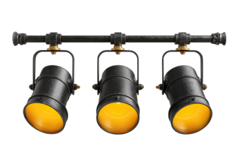 Industrial-style spotlights mounted on a metal bar.  Three black cylinder spotlights with warm yellow light, hanging from a dark gray metal pipe.  Brass accents.  Isolated on black background
