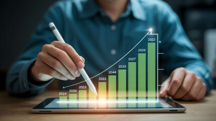 Person using stylus on tablet displaying holographic green bar graph with upward trend image