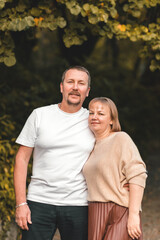 portrait of a happy mature couple in the autumn park