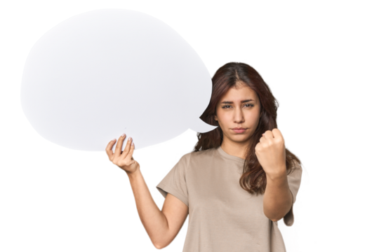 Middle Eastern woman holding comic bubble showing fist to camera, aggressive facial expression.