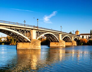 Fototapeta premium Steel bridge over calm river, autumn colours