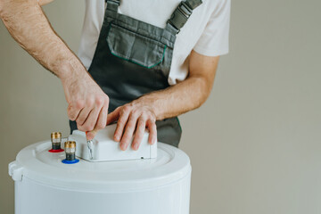 Close-up of hands in action with tools repairing boiler