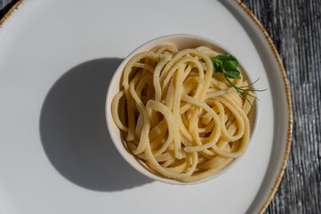 A plate of boiled spaghetti in a cafe. 