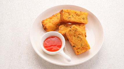 Homemade tofu nuggets served with chilli sauce
