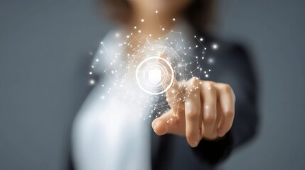 A woman with a focused expression interacts with a digital interface using her fingertip, showcasing innovative technology.